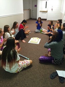 Jill and her hall mates celebrating a birthday in their hall meeting 